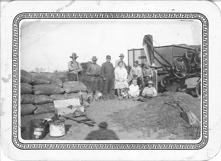 Restored Perry Ranch peanut-harvest photograph showing Jim, Raymond and Otis Perry with Ramon and family members
